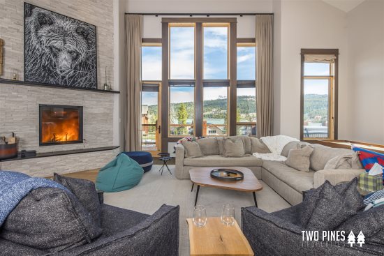 Main Livingroom with Floor to Ceiling Windows and Balcony Access