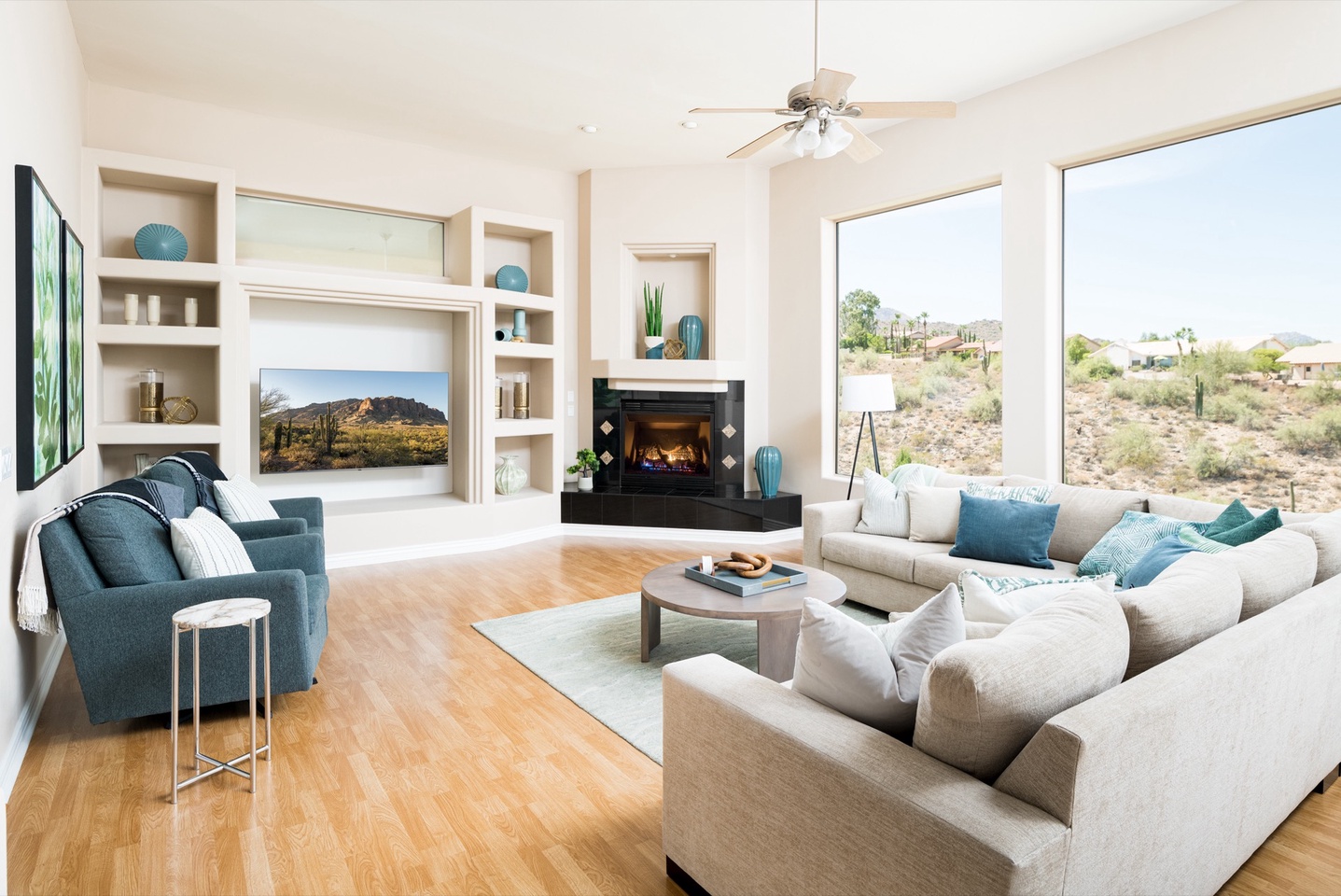 Living room with television, fireplace, and valley views