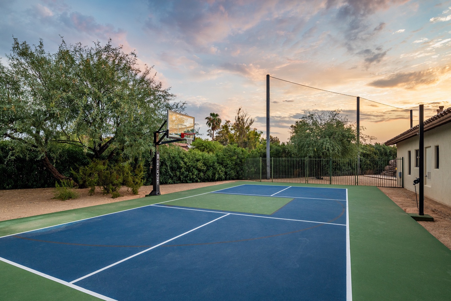 Basketball court that can be turned into a volleyball or pickle ball court