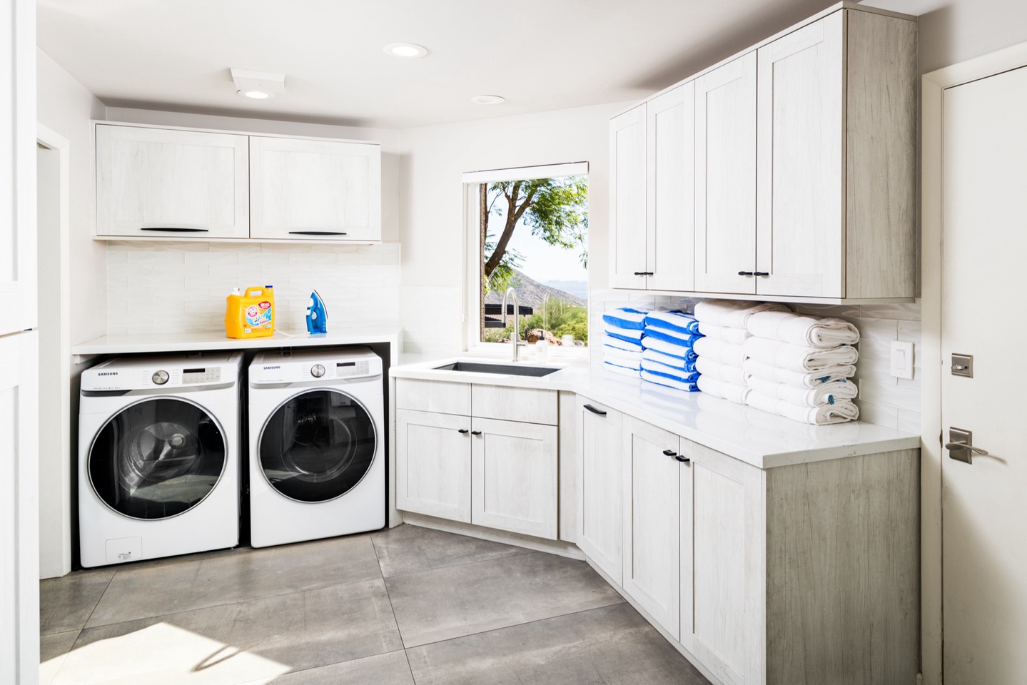 Laundry room with washer, dryer, deep sink