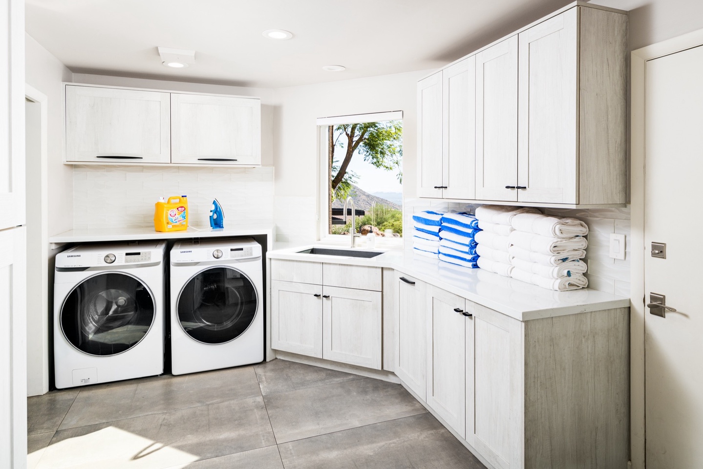 Laundry room with washer, dryer, deep sink