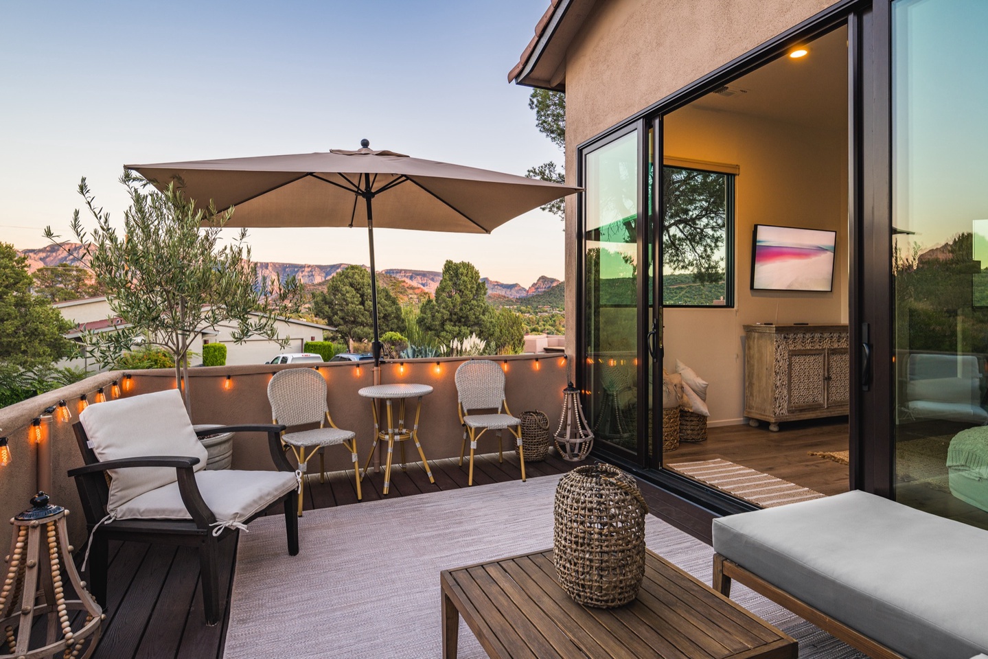 Spacious patio with seating for all, just outside the living room