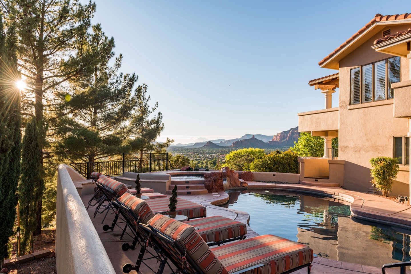 Plenty of lounge space by the pool that compliments the views