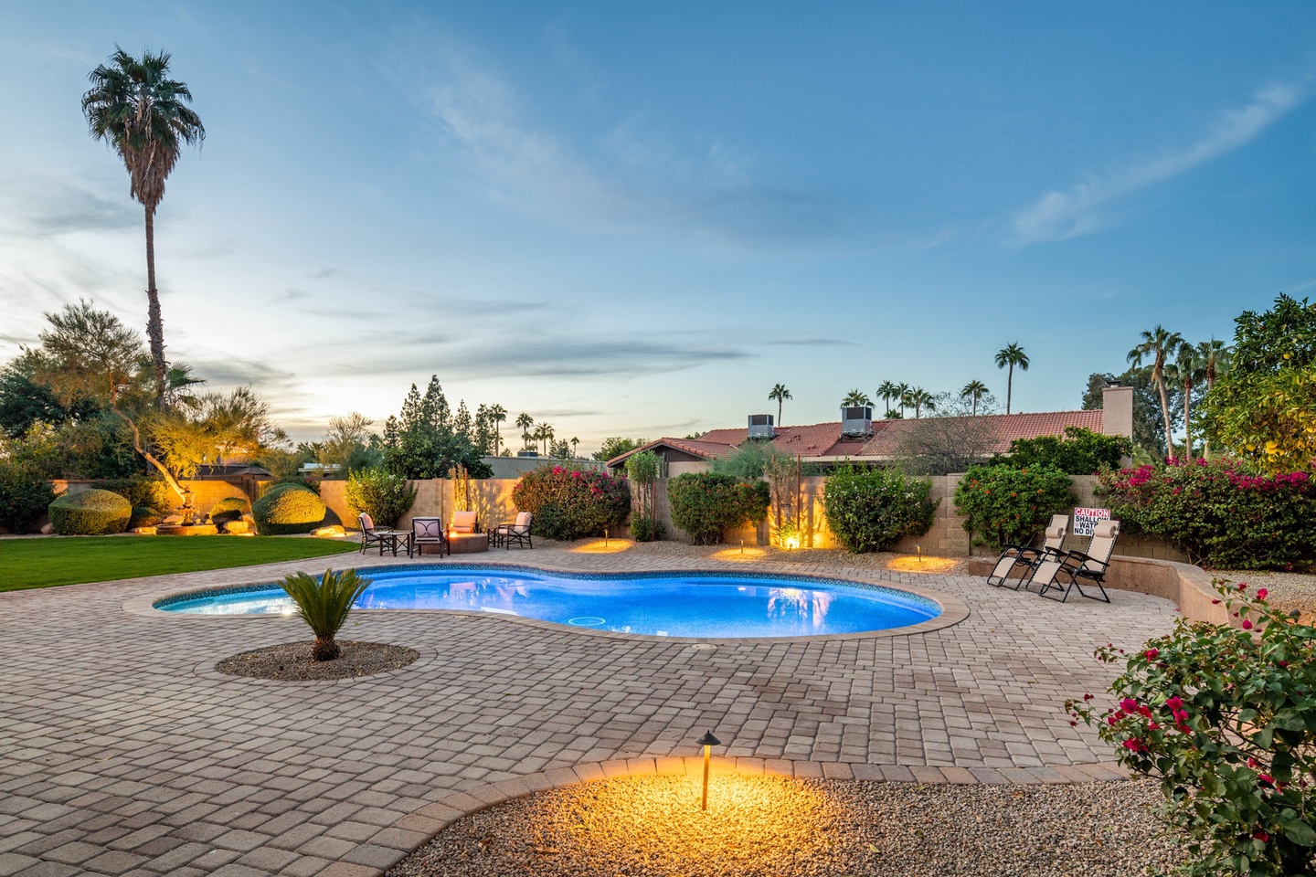 Large heated* pool surrounded by tons of decking