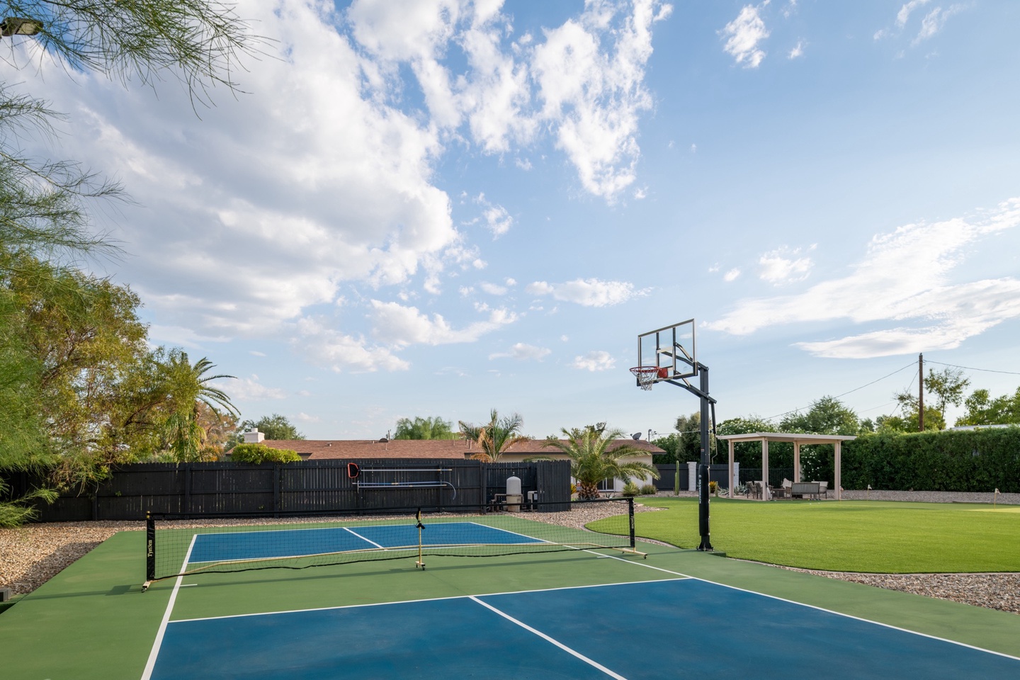 Brand new pickle ball court with basketball hoop