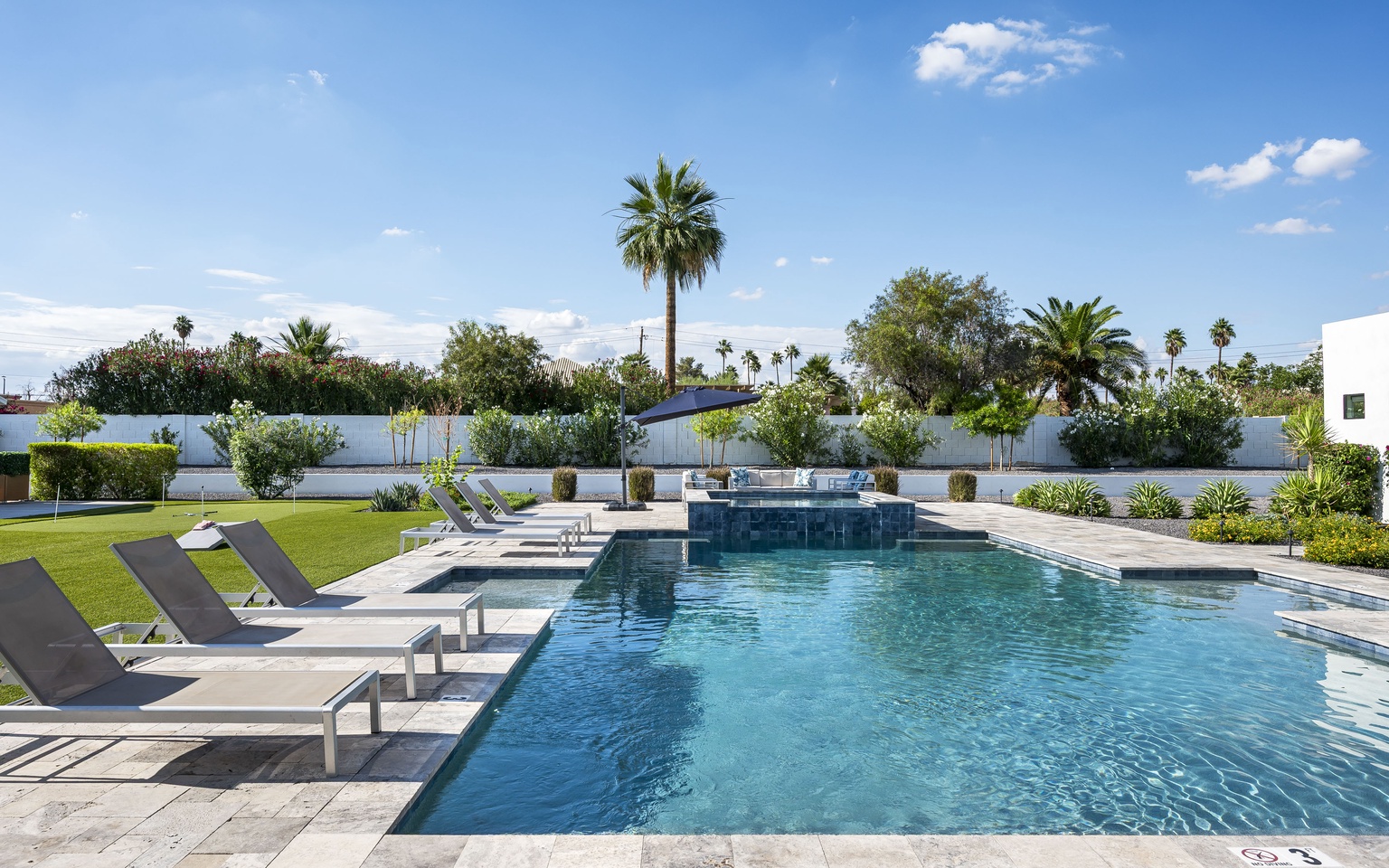 Large pool with 2 Baja shelves for lounging
