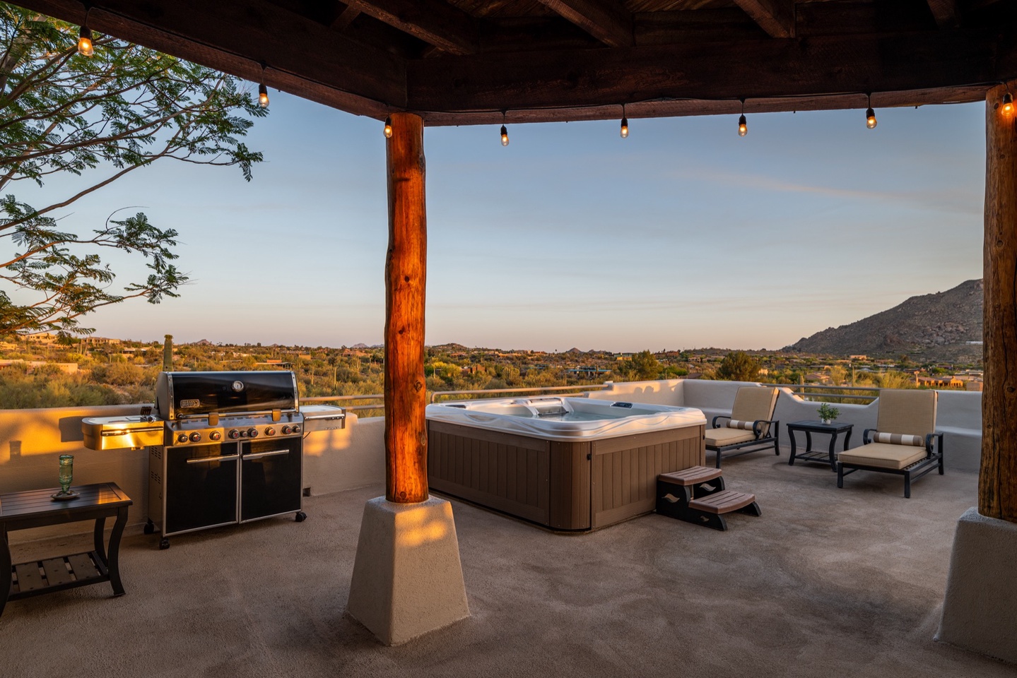 Large BBQ grill next to hot tub