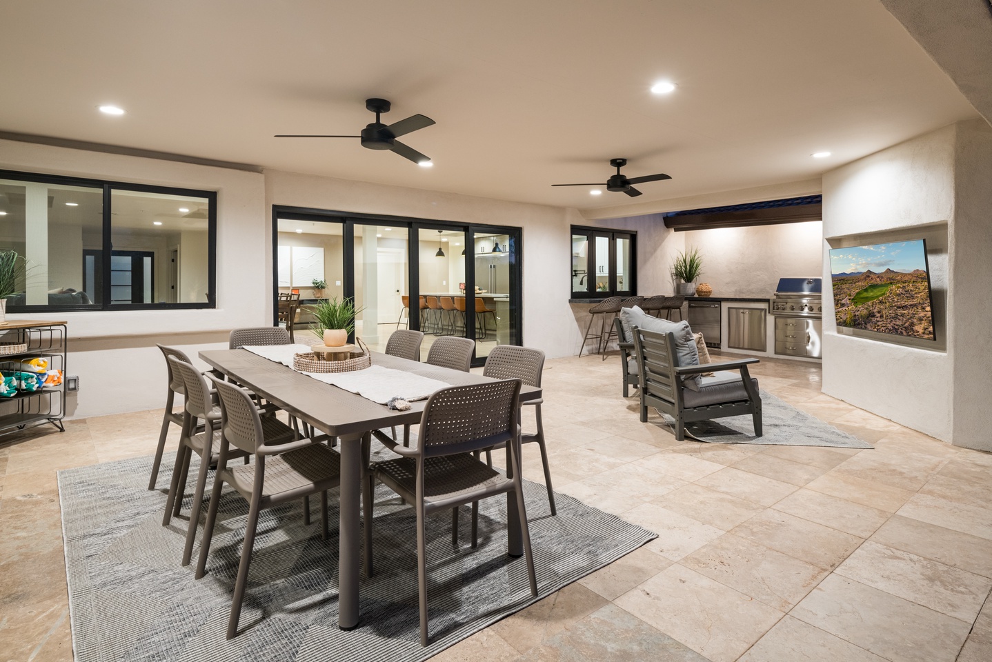 Spacious outdoor patio with TV and dining space